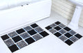 Microfiber tufted bath mat set with box design, featuring a modern black and white pattern, perfect for bathroom decor.