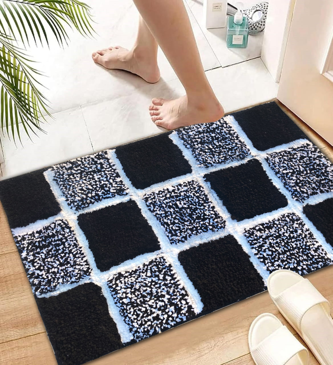 Microfiber tufted bath mat with box design, providing comfort and style for bathrooms.