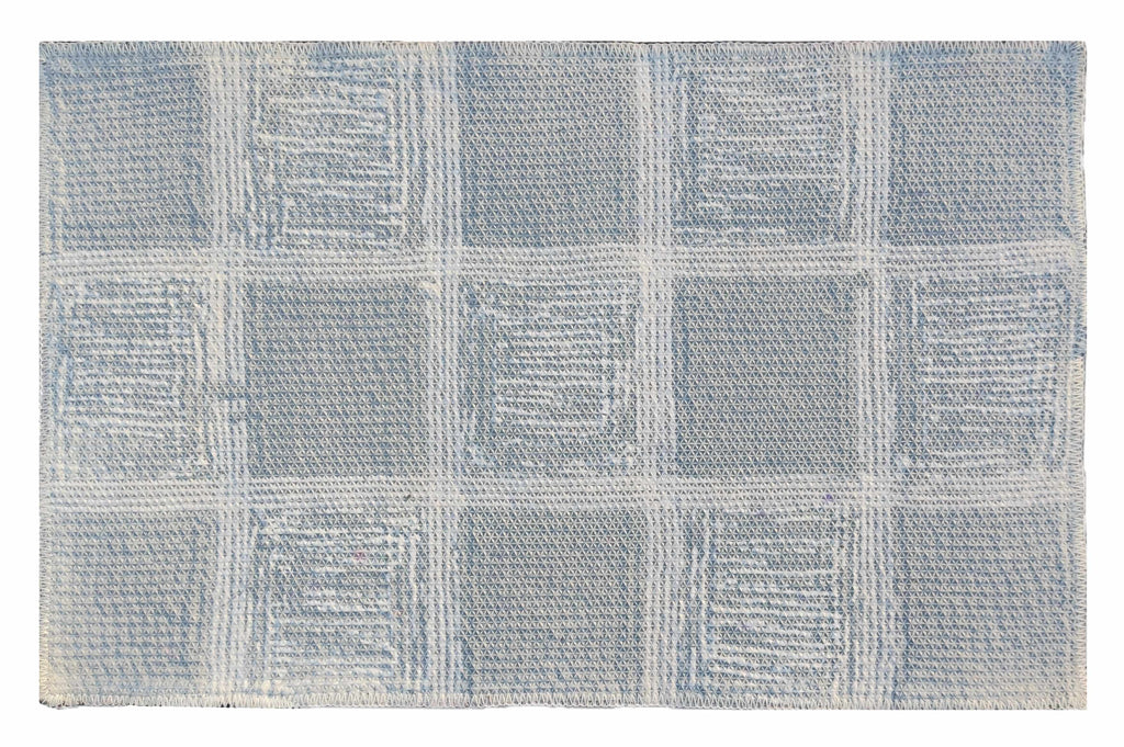 Microfiber tufted bath mat with box design in soft blue color, perfect for bathroom style and comfort.